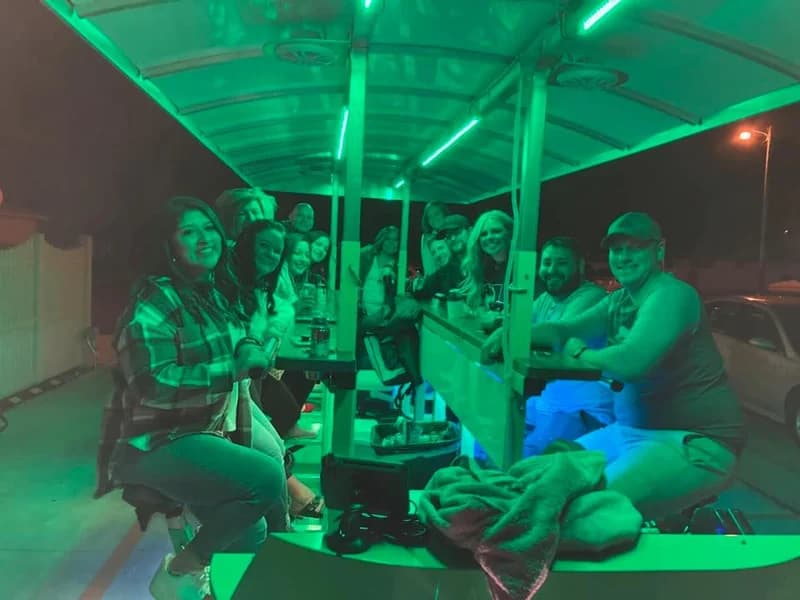 Inside the trolley at night, glowing green LEDs